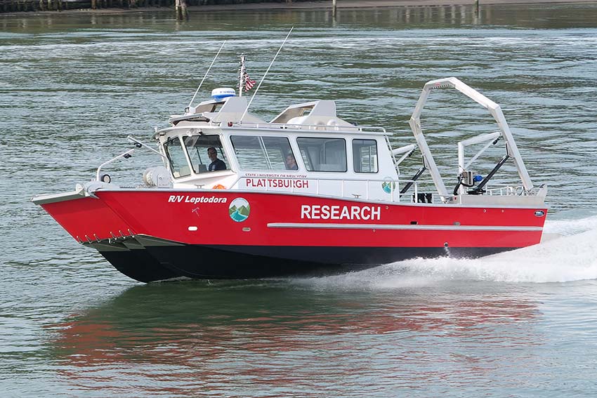 "Leptodora" 36 ft research vessel on Lake Champlain creating a wake.