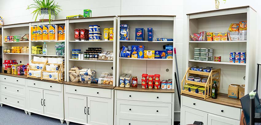 Selections of dried and canned goods and toiletries in Cardinal Cupboard