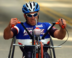 Photo of Matt Updike riding his handcycle