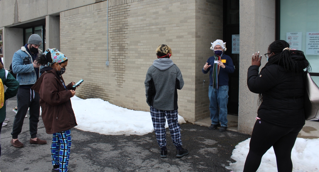 doc sheehan greets students to pool testing